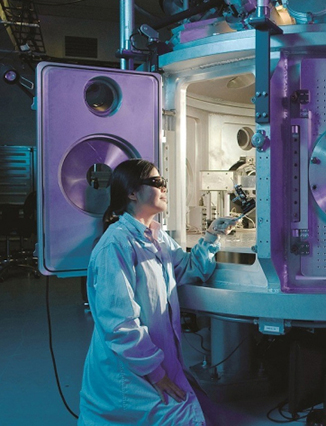 Scientist putting samples inside machine